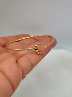 18K Solid Gold Bangle Bracelet / Genuine Real 18K Gold Cuff Bangle Bracelet For Men & Women / Birthday Gift, Anniversary Gift for Her/Him! --- Created in GURANTEED HIGH QUALITY 18K SOLID GOLD ---  Size 17 = 17cm (6.7 inches)  Gram weight: 3.14 gr Bangle length: 2 3/8 inches - 61 millimeter   Bangle width: 2 1/8 inches - 54 mm Bangle thickness: 1.76 mm   Closer: Pull/Push lock - really strong and durable - wear it every day, all day! Simple and chic! Elegantly handmade! This perfect yellow solid gold bangle cuff bracelet makes you become the center of attention. ** About 18K Solid Gold 18k solid gold pieces are made to last forever. Solid 18K gold jewelry is the most expensive and high quality option as it doesn't rub off or flake, and doesn't tarnish. Solid gold actually increases in value Gold Hoop Cuff Bracelet Gift, Anniversary Hoop Bracelets, Gold Hoop Cuff Bracelet As Gift, Rose Gold Hoop Bracelets For Gift, Gold Round Bangle For Anniversary, Hoop Shaped Yellow Gold Bangle For Gift, Yellow Gold Hoop Bangle For Gift, Hoop Yellow Gold Bracelet For Anniversary, Yellow Gold Hoop Bracelet For Anniversary