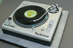 a cake made to look like a turntable with the word technics on it