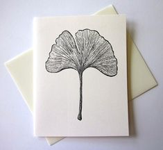 a card with a black ink drawing of a ging sprout leaf on it