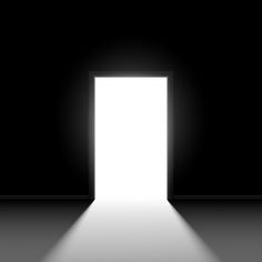 an open door in the dark with light coming from it's center and floor