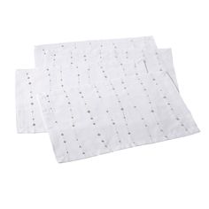 two white napkins with silver dots on them