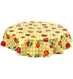 a yellow and white checkered table cloth with red apples on it, sitting in front of a white background