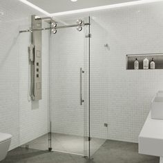 a bathroom with a toilet, shower and sink in black and white photo taken from the inside