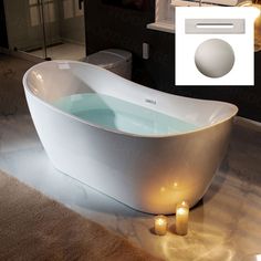 a white bath tub sitting on top of a bathroom floor next to candles and a mirror