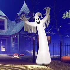 a large white ghost standing in front of a house