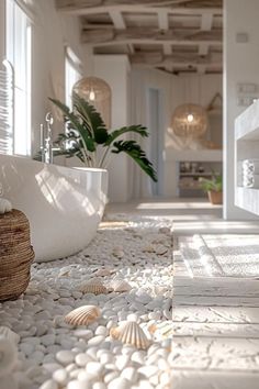 a bath room with a large tub and a plant in the corner on the floor