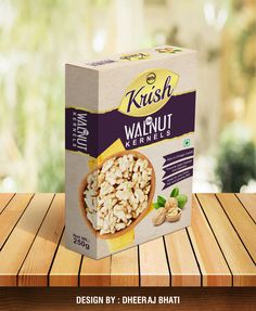 a box of krish walnuts sitting on top of a wooden table next to a window