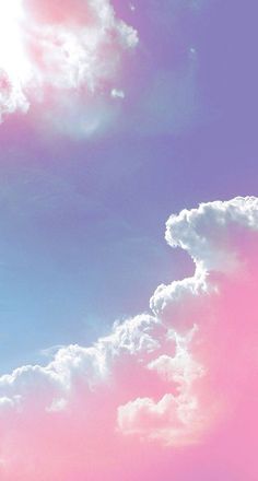 an airplane is flying in the sky with pink and blue clouds behind it on a sunny day