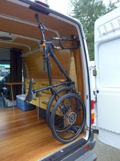 a bike is parked in the back of a van