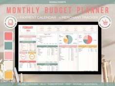 the printable budget planner is displayed in front of a computer screen with other items on it