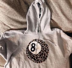 Handmade Patchwork Cheetah Print 8 Ball Hoodie. Please read the full product description below before ordering! Model is wearing a size s  ⋆ ˚｡ ⋆୨♡୧⋆ ˚｡ ⋆ Join our instagram @rainy.swagg & tag us in your pics! ♡ ✩ QUALITY & SUSTAINABILITY ✩ *100% cotton hoodie, hand sewn by me!  * Every one of our hoodie is made to order to reduce waste. * Our hoodies are original designs, created with love ✩ SHIPPING TIMES ✩ United States ONLY!  standard shipping 3-7 days  express shipping 2-3 days  (does take How Lucky Are We Hoodie Diy, 8 Ball Sweatshirt, How Lucky Are We Sweatshirt Diy, Dream Clothes Y2k, Easy Cute Sewing Ideas, Hoodie Made From Quilt, Black Embroidered Sweatshirt, Cute Diy Hoodies, Iron On Letters Shirt Diy Ideas