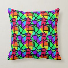 a colorful pillow with an abstract design on it