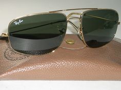 You are bidding on very gently/slightly/barely used, stunning looking pair of 1980's 58[]17mm VINTAGE B&L RAY BAN W0502 GEP ARISTA G15 UV SLEEK EXPLORER AVIATOR SUNGLASSES w/CASE. Please see pictures for further details & markings. Both lenses as well as nose pads are etched with small BL logo. LOOKS PRACTICALLY BRAND NEW...MINT G15 UV GLASS LENSES.  Distance b/w the hinges is 5 1/4", overall vertical height is 1 3/4" & length of temple arm is 5". Consolidated shipping is offered on multiple ite Randolph Engineering, Ray Ban Frames, Sunglasses Mens, Gold Aviator Sunglasses, Fashion Eye Glasses, Aviator Sunglasses Mens, Eye Glasses, Aviator Sunglasses, Fashion Sunglasses