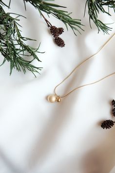 This stunning miniature Christmas baubles necklace is made of stainless steel and is 14k gold plated, lead and nickel free. It makes a fantastic Christmas gift for you or your loved ones. Chain length: 40cm + 5cm extender chain All of our jewellery comes beautifully packaged in our branded gift box. Your jewellery will last longer if you correctly care for your item. Care instructions: Always remember to remove your jewellery before shower or exercise. Please avoid contact with perfumes, body oils, and other chemicals, including household cleaners. For cleaning, gently polish with a soft, lint-free cloth to avoid scratching. Please store it in a cool dry place. If you have any questions do not hesitate to contact me, I will be more than happy to answer! Follow @donlonco on Instagram to see Festive Gold Jewelry With Delicate Chain, Gold Pendant Jewelry For Christmas, Gold Necklace For Christmas Celebration, Gold Necklaces For Holiday, Gold Jewelry For Festive Holiday Occasions, Gold Necklaces For Christmas Celebration, Gold Necklace For Holiday Gift, Gold Necklace Holiday Gift, Holiday Gold Necklace Gift