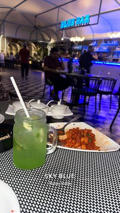 a table with food and drinks on it in a restaurant or diners'dining room