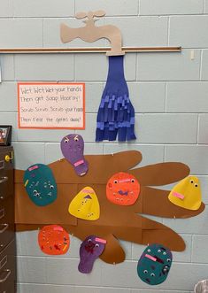 a bulletin board with paper cutouts on it