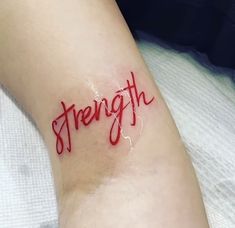 the word strength is written in red ink on someone's left arm and leg