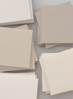 several different shades of white paper laid out on top of each other