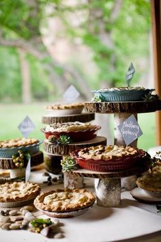 several pies and pie dishes on a table