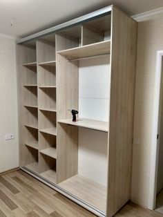 an empty room with some shelves in it