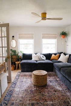 a living room filled with furniture and a rug