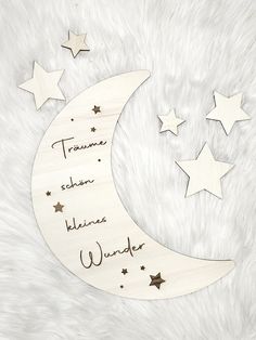 a wooden sign with stars on it that says,'truanne selon klinge wonder '