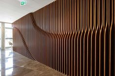 a large wooden wall in an office building