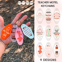 a hand holding several different colored tags in it's palm and the words teacher motel keychains on them