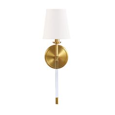 a wall light with a white shade on the side and a gold metal frame around it