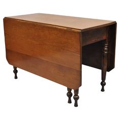 an old wooden desk with one drawer open