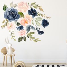 a floral wall decal with blue and pink flowers