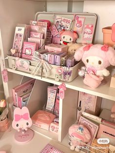 a shelf filled with lots of pink stuff animals and other items on top of it