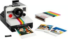 an old polaroid camera with some pictures on it