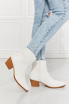 These Western-inspired booties feature a stacked heel and a faux leather upper. Their pointed toe adds a refined detail, making these a perfect choice to finish any outfit. Size fit: True to size Pattern type: Solid Type: Booties Toe: Point toe Heel height: Low heels Heel shape: Block heels Material: PU leather /Wood sole Imported Product measurements: Heel height: 2.5 inchMMShoes has made a name for itself in European and Asian markets through footwear trade shows, In 2021, MMShoes started its Western Ankle Boots, Leather Western Boots, High Quality Shoes, Pointed Toe Heels, Low Block Heels, Stacked Heel, Western Boots, Low Heels, Bootie