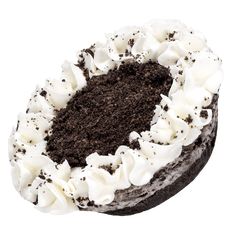 a cake with white frosting and chocolate shavings