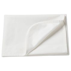 a white sheet folded on top of a bed