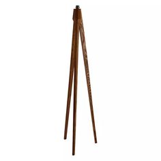 a wooden tripod floor lamp on a white background