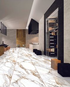 a large room with marble floors and walls