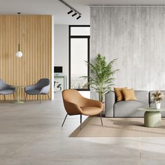 a living room filled with furniture next to a tall wooden paneled wall and floor