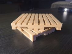 two wooden slats sitting on top of a table