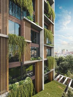 an apartment building with plants growing on the balconies