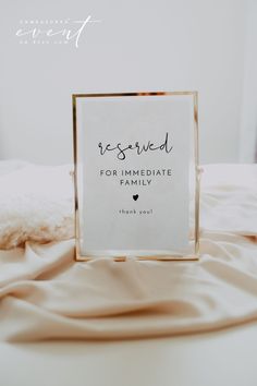 a sign that says reserved for immediate family on top of a bed with white sheets