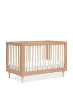 a baby crib with white sheets on the bottom and side rails, in front of a white background