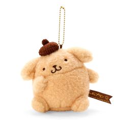 a brown teddy bear with a hat on its head is hanging from a gold chain