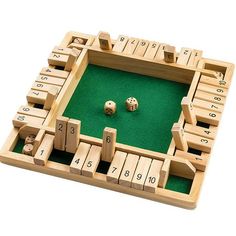 a wooden board game with numbers and dices