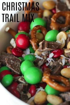 a white bowl filled with christmas trail mix