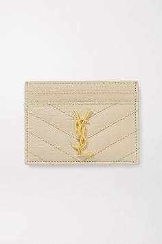 SAINT LAURENT's cardholder is part of the brand's 'Monogramme' collection, identifiable by its quilted designs and 'YSL' logo hardware. Made in Italy from textured-leather, it has four slots for your most-used cards and a pocket for folded bills or receipts. Chanel Card Holder Beige, Luxury Formal Card Holder With Embossed Logo, Designer Leather Card Holder With Logo, Designer Leather Card Holder With Embossed Logo, Designer Rectangular Wallets With Gold-tone Logo Plaque, Luxury Leather Beige Card Holder, Luxury Beige Leather Card Holder, Luxury Gold Leather Card Holder, Designer Quilted Leather Wallet