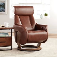 a brown recliner chair sitting in front of a table