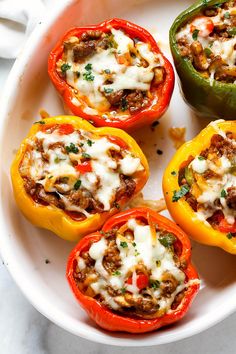 stuffed bell peppers on a plate with a fork