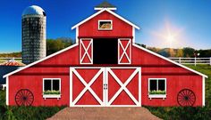 a red barn with white trim and windows at night